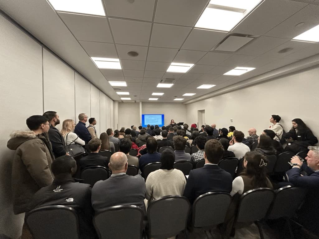 Audience gathered for an AiSK session presentation.
