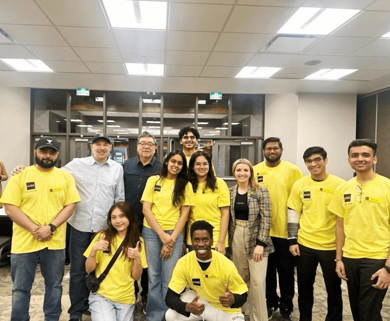 AiSK volunteers welcoming guests at SASK AI EXPO